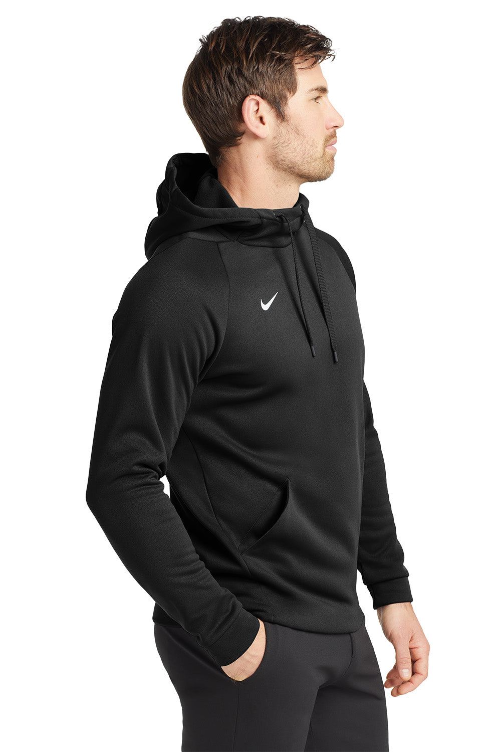 Man wearing a black hoodie with a Nike logo on a white background. Nike Therma-FIT Pocket Pullover Fleece Hoodie, Comstock Park Logo by Helmsman Stitch Co.