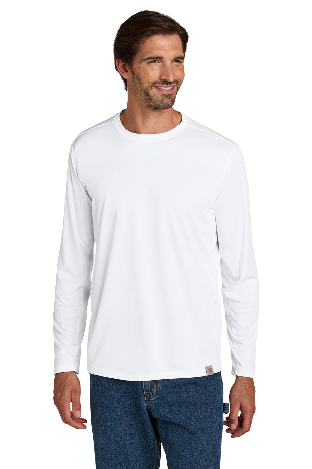 Man wearing a white long-sleeve shirt and blue jeans on a white background embroidered Carhartt Force® Sun Defender™ Long Sleeve Shirt
