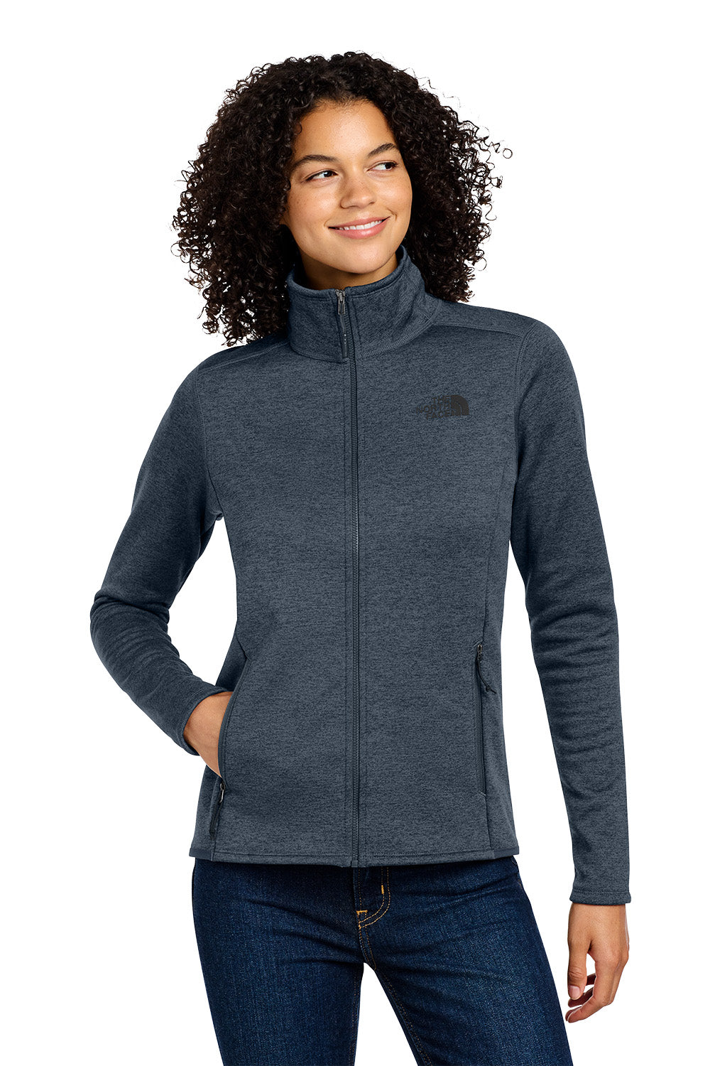 Woman wearing a gray jacket with a brand logo on a white background embroidered The North Face® Women's Skyline Full-Zip Fleece Jacket