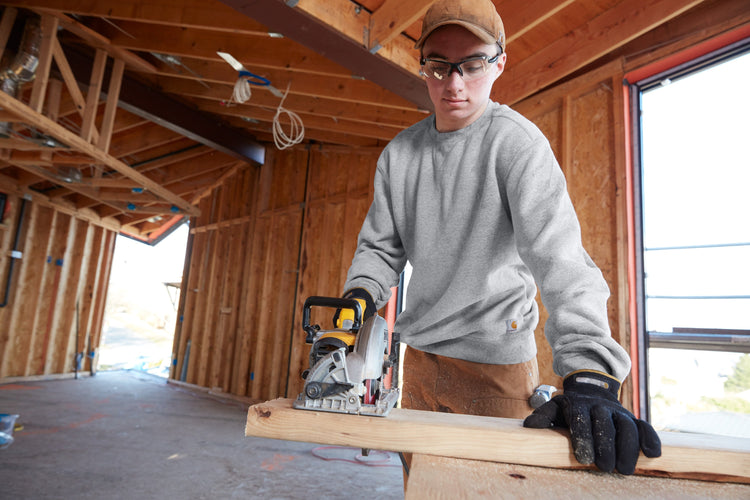 man building a house in a pullover sweatshirt, ready for embroidery