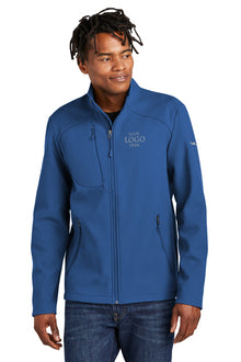 Man wearing a blue jacket with a logo on a white background, embroidered Eddie Bauer® Stretch Soft Shell Jacket