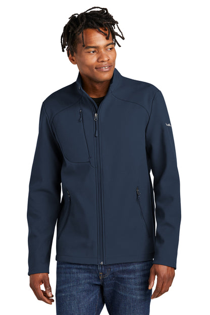 Man wearing a navy blue jacket on a white background, embroidered Eddie Bauer® Stretch Soft Shell Jacket