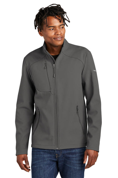 Man wearing a gray soft shell jacket on a white background, embroidered Eddie Bauer® Stretch Soft Shell Jacket