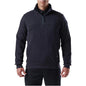 Man wearing a dark blue pullover with a white background. 5.11 Job Shirt 1/4 Zip 2.0, Embroidered by Helmsman Stitch Co.