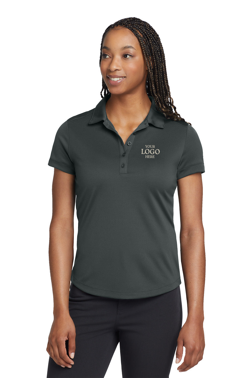 Woman wearing a dark gray polo shirt with 'Your Logo Here' text on a white background, embroidered Nike Women's Dri-FIT Players Modern Fit Polo