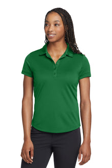 Woman wearing a green polo shirt on a white background, embroidered Nike Women's Dri-FIT Players Modern Fit Polo