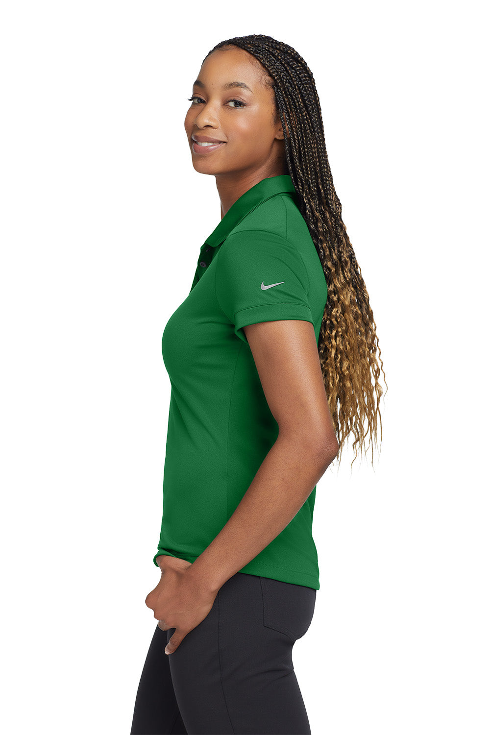 Woman wearing a green Nike polo shirt on a white background, embroidered Nike Women's Dri-FIT Players Modern Fit Polo