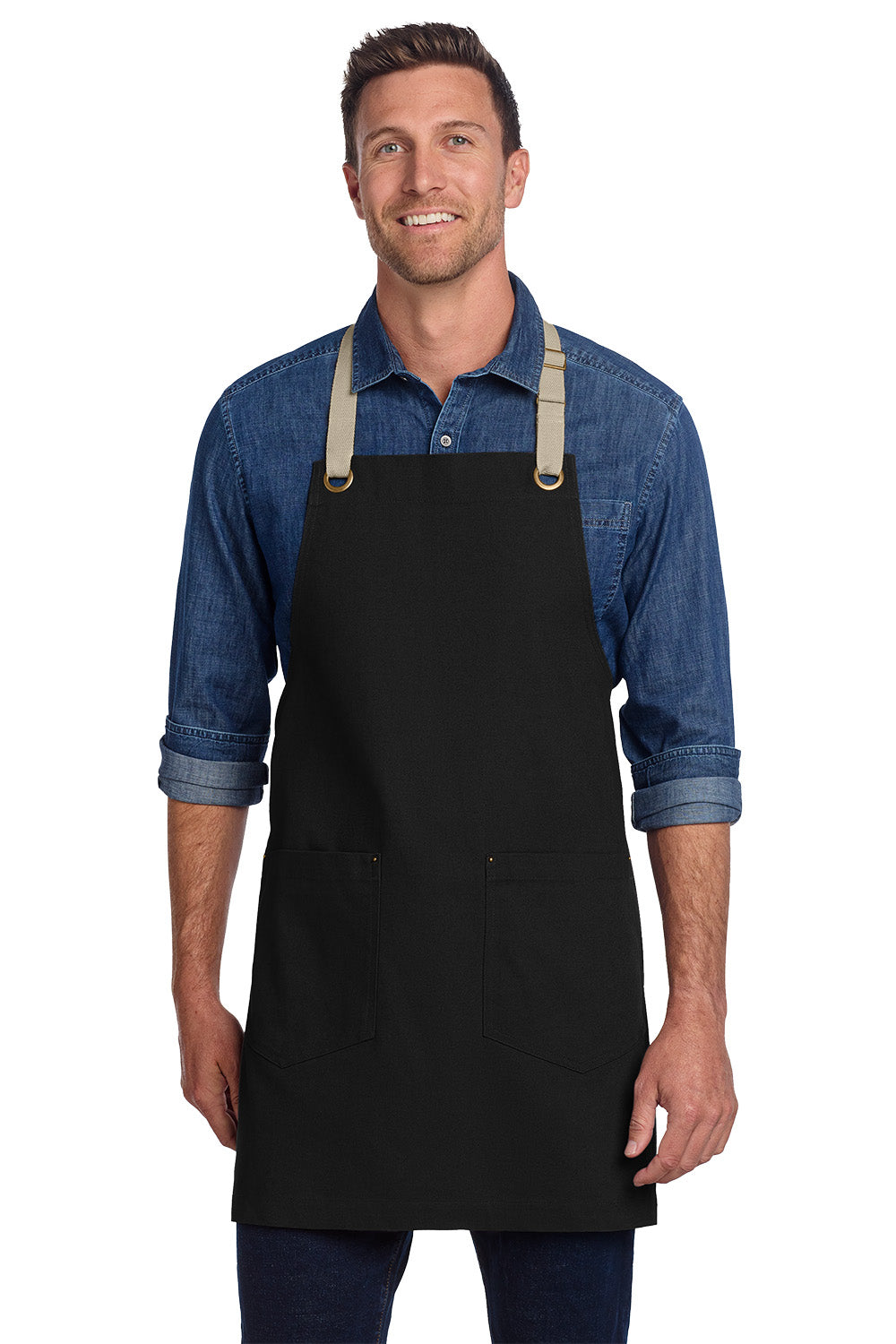 Man wearing a black apron over a blue denim shirt on a white background, Port Authority® Canvas Full-Length Two-Pocket Apron, Embroidered