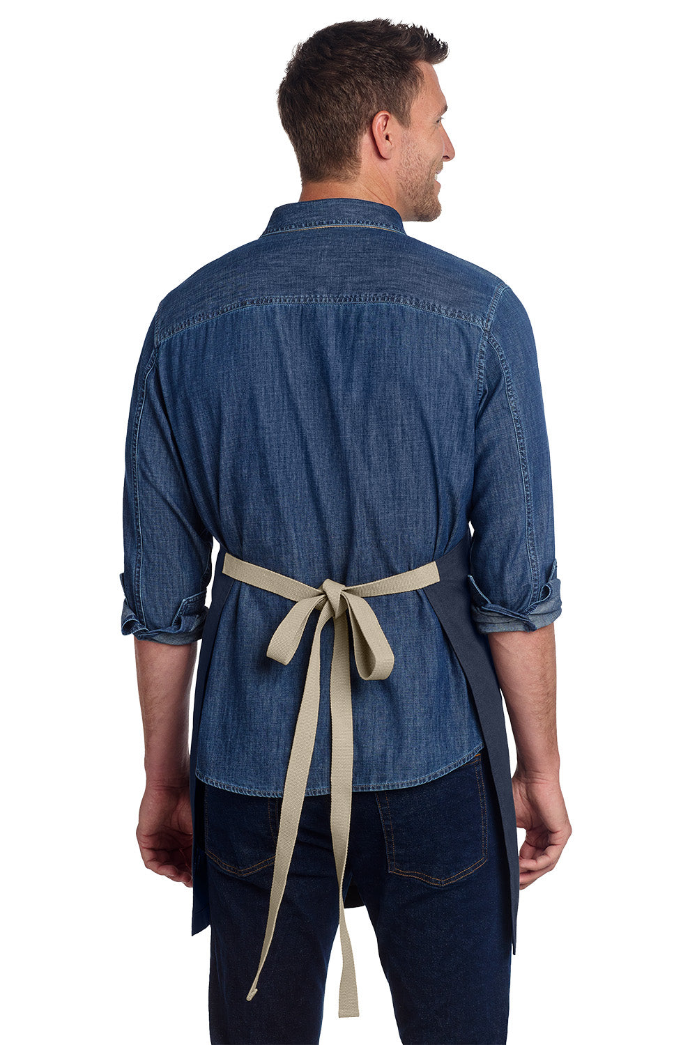 Man wearing a blue denim shirt with rolled-up sleeves and a beige apron on a white background, Port Authority® Canvas Full-Length Two-Pocket Apron, Embroidered