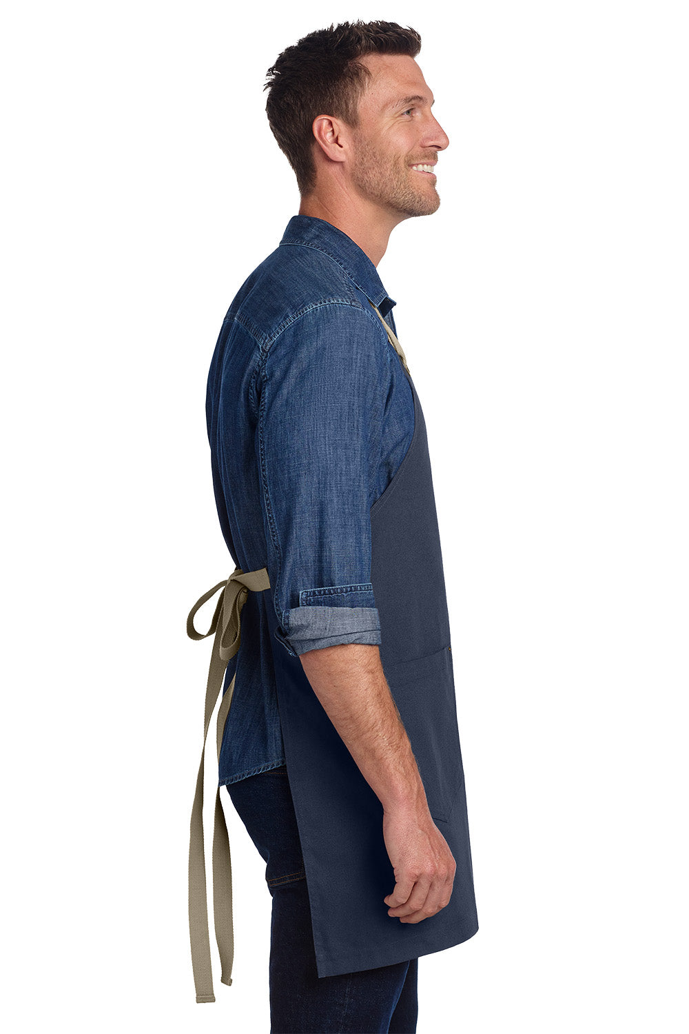 Man wearing a blue apron over a denim shirt on a white background, Port Authority® Canvas Full-Length Two-Pocket Apron, Embroidered