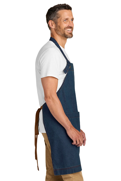 Man wearing a blue apron over a white shirt on a white background Port Authority® Signature Denim Apron, Embroidered