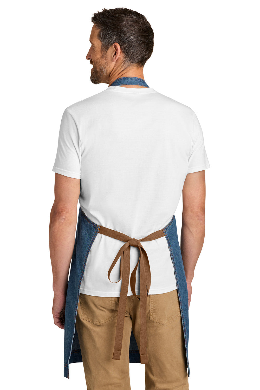 Man wearing a white shirt, brown pants, and a blue apron with a brown belt on a white background Port Authority® Signature Denim Apron, Embroidered