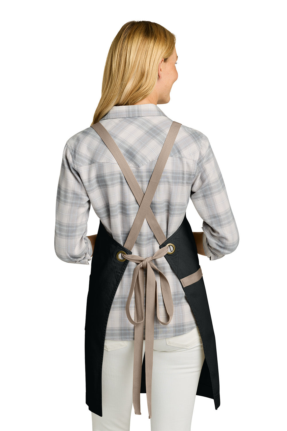 Woman wearing a black apron with beige straps on a white background. Port Authority® Signature Heavy Twill Crossback Apron, Embroidered