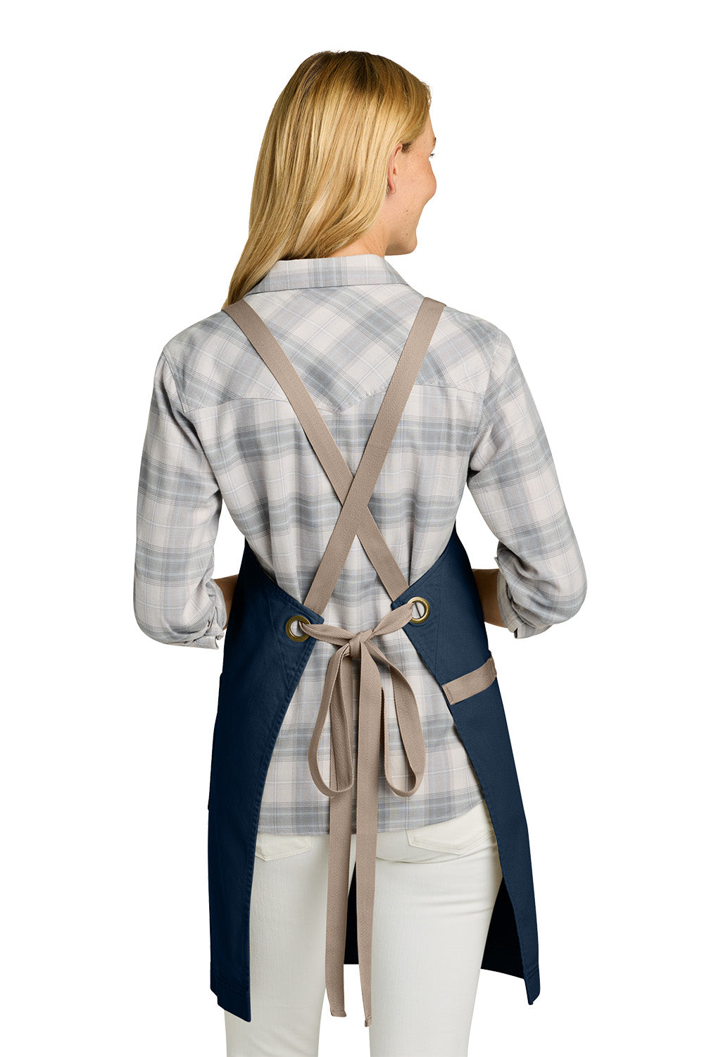Woman wearing a blue apron with beige straps on a white background. Port Authority® Signature Heavy Twill Crossback Apron, Embroidered
