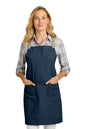 Woman wearing a navy apron on a white background. Port Authority® Signature Heavy Twill Crossback Apron, Embroidered