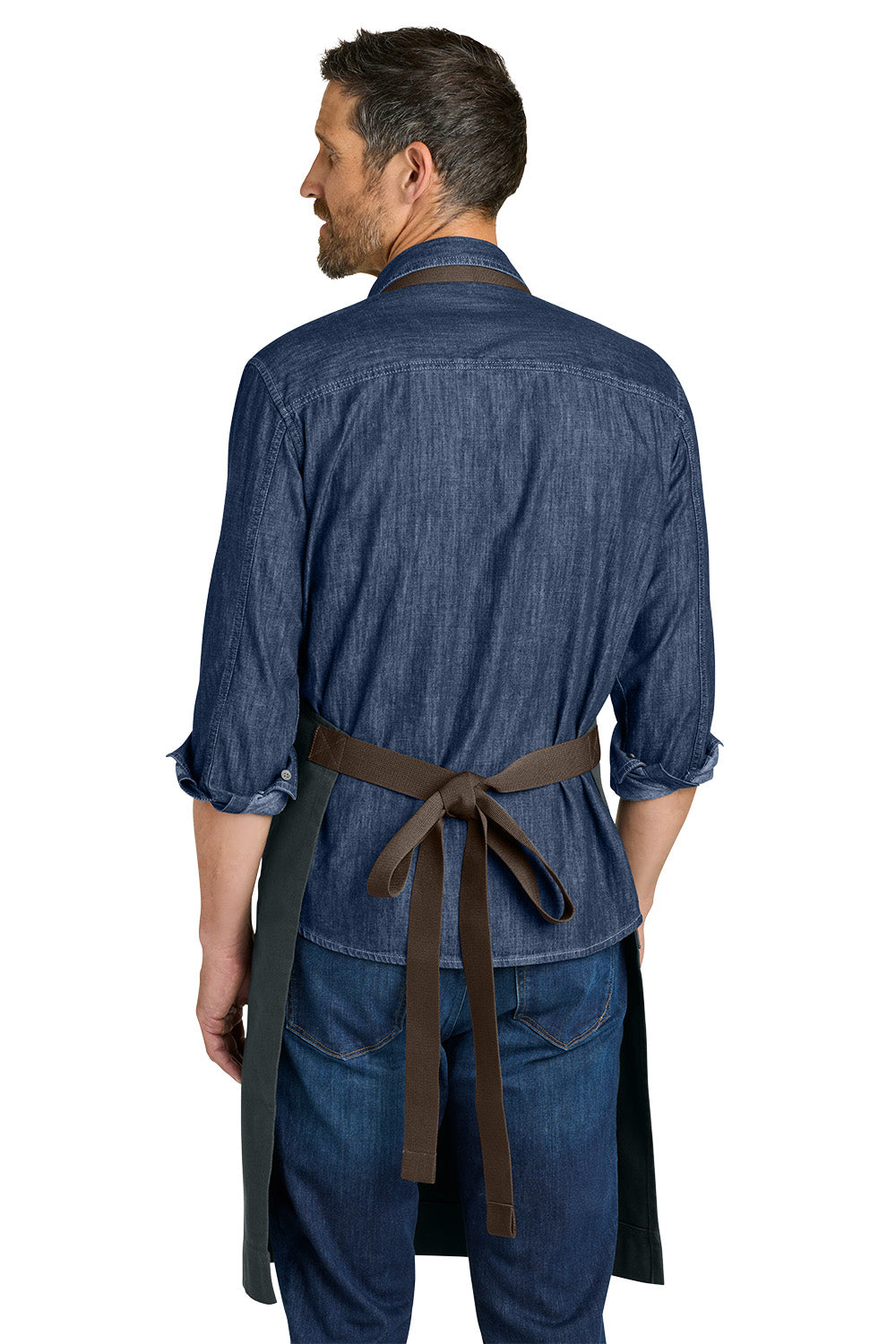 Man wearing a blue denim outfit with a brown belt on a white background Port Authority® Signature Workwear Apron, Embroidered