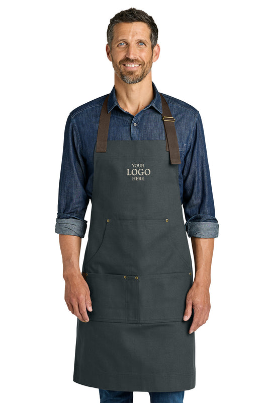 Man wearing a black apron with customizable logo text on a white background Port Authority® Signature Workwear Apron, Embroidered