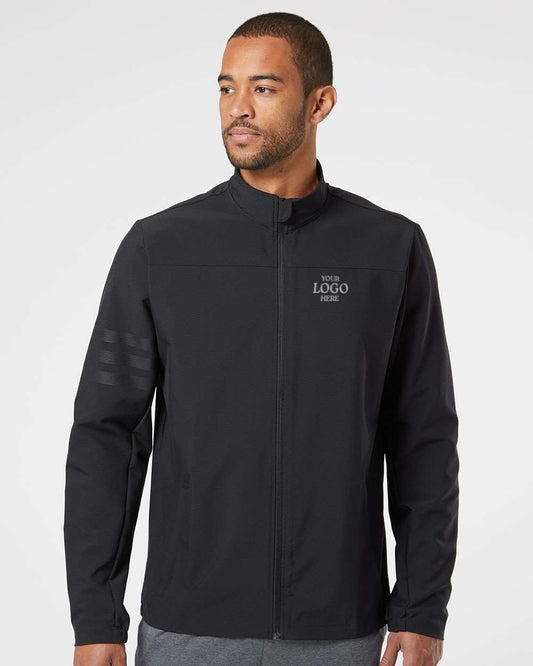 Man wearing a black jacket on a white background. Adidas Men's Wind Resistant Full-Zip Jacket, Embroidered by Helmsman Stitch Co.