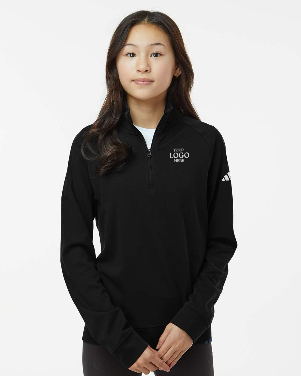Person wearing a black Adidas sweatshirt on a white background. Adidas Youth Performance Quarter-Zip Pullover, Embroidered by Helmsman Stitch Co.