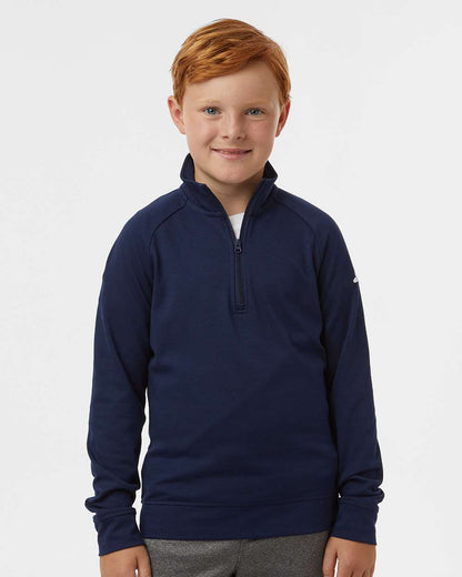 Child wearing a navy blue pullover with a zipper on a white background. Adidas Youth Performance Quarter-Zip Pullover, Embroidered by Helmsman Stitch Co.