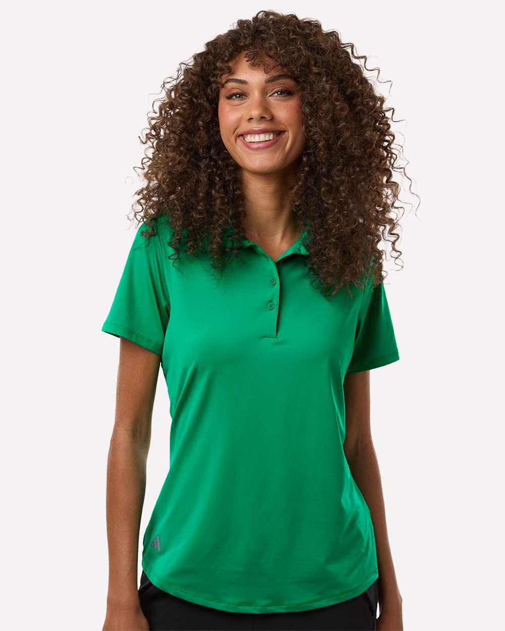 Woman wearing a green polo shirt on a white background. Adidas Women's Ultimate365 Solid Polo, Embroidered by Helmsman Stitch Co.