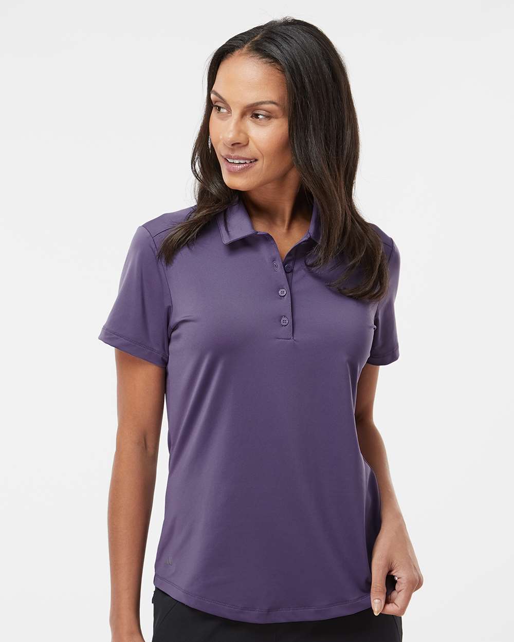Woman wearing a purple polo shirt on a white background. Adidas Women's Ultimate365 Solid Polo, Embroidered by Helmsman Stitch Co.