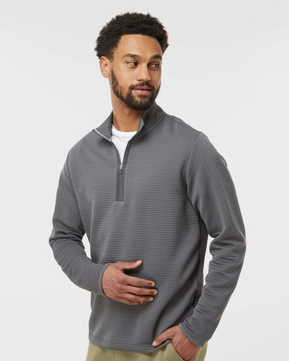Man wearing a gray quarter-zip pullover on a light gray background. Adidas Men's Spacer Quarter-Zip Pullover, Embroidered by Helmsman Stitch Company