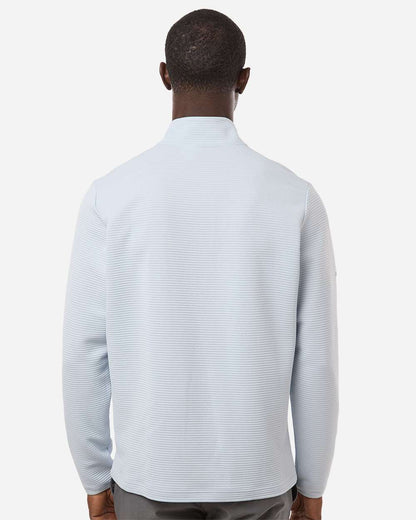 Man wearing a light blue sweater on a white background. Adidas Men's Spacer Quarter-Zip Pullover, Embroidered by Helmsman Stitch Company