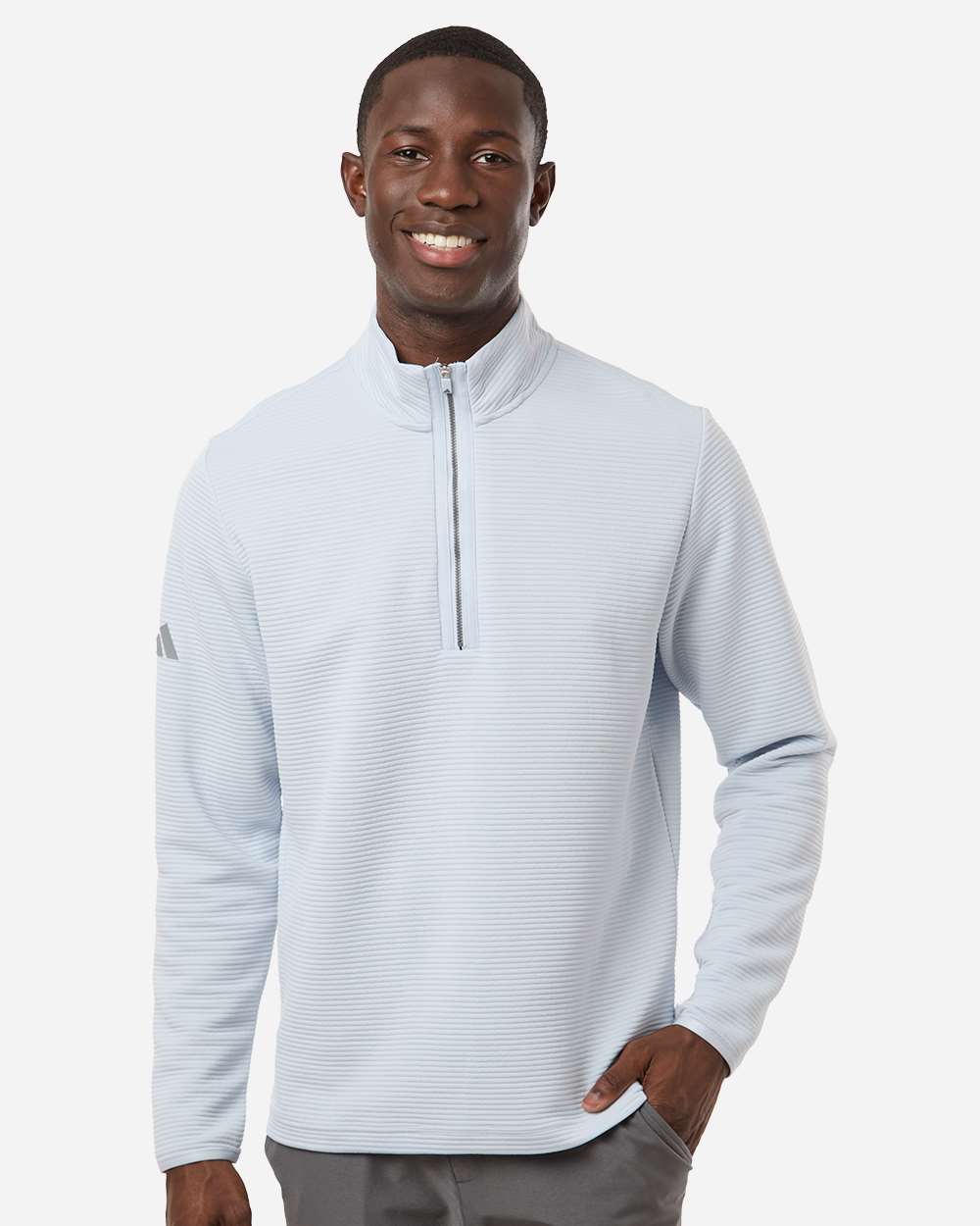 Man wearing a light gray Adidas pullover on a white background. Adidas Men's Spacer Quarter-Zip Pullover, Embroidered by Helmsman Stitch Company