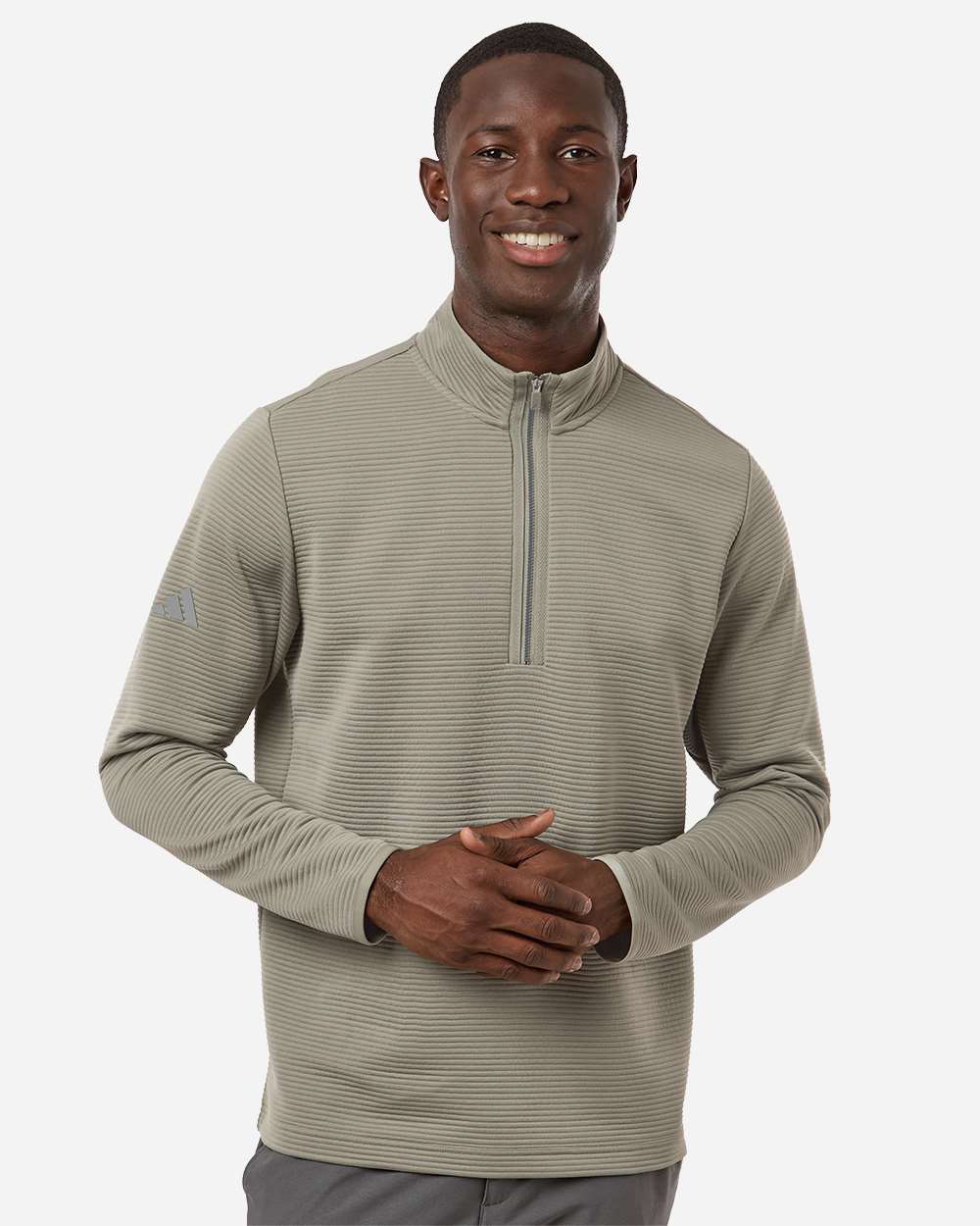 Man wearing a beige long-sleeve shirt with a quarter-zip on a white background. Adidas Men's Spacer Quarter-Zip Pullover, Embroidered by Helmsman Stitch Company