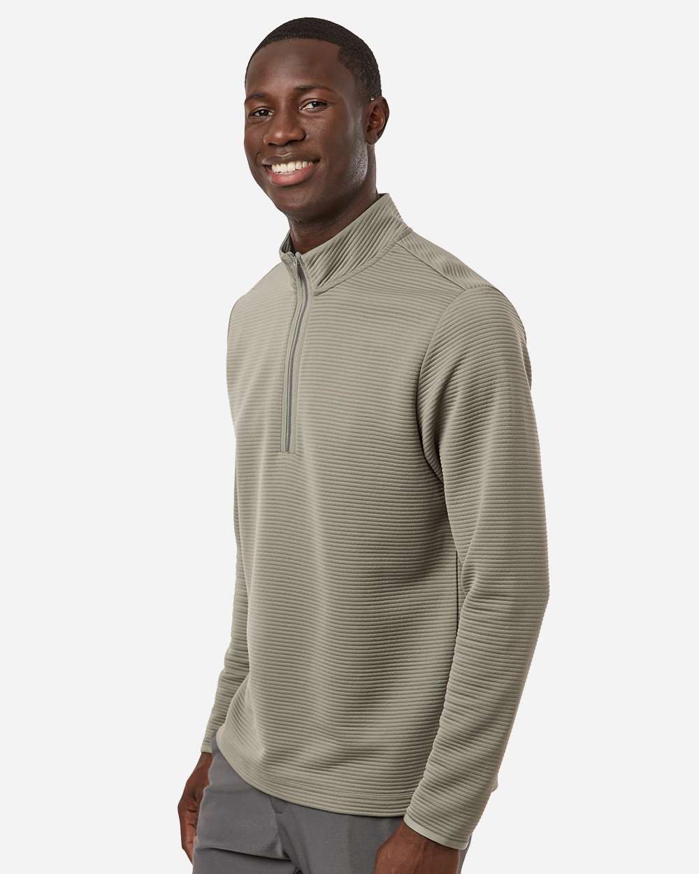 Man wearing a green long-sleeve shirt with a quarter zip on a white background. Adidas Men's Spacer Quarter-Zip Pullover, Embroidered by Helmsman Stitch Company