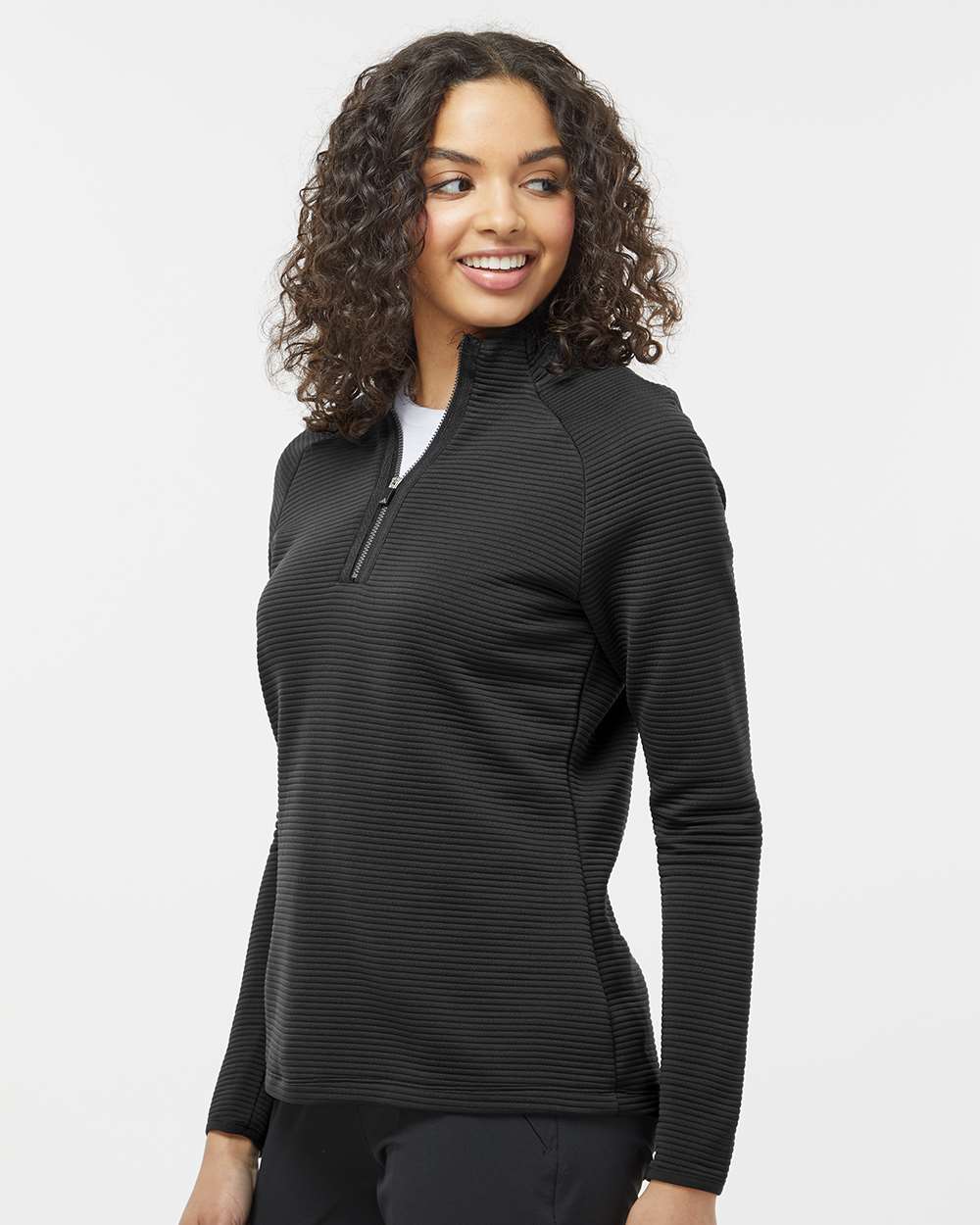Woman wearing a black long-sleeve pullover with a zipper on a white background. Adidas Women's Spacer Quarter-Zip Pullover, Embroidered by Helmsman Stitch Co.