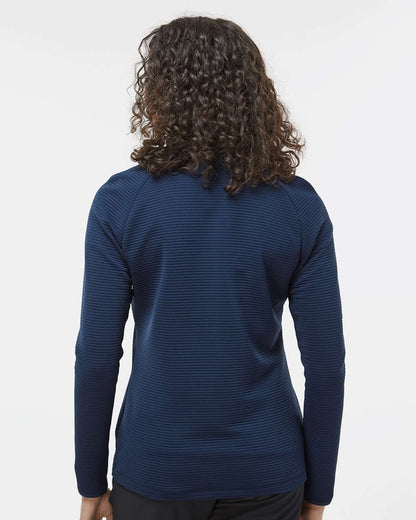Person wearing a blue long-sleeve shirt on a white background. Adidas Women's Spacer Quarter-Zip Pullover, Embroidered by Helmsman Stitch Co.