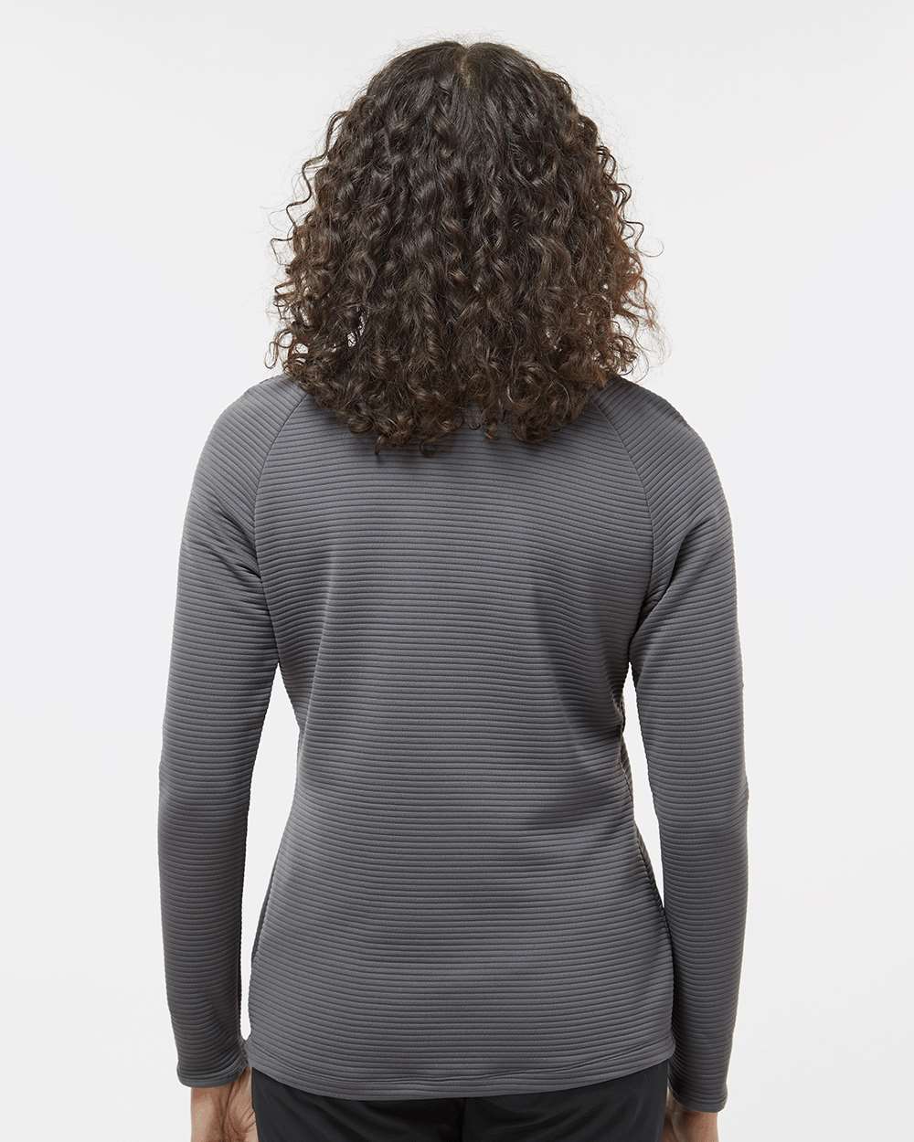 Person wearing a gray long-sleeve shirt with a subtle pattern on a white background. Adidas Women's Spacer Quarter-Zip Pullover, Embroidered by Helmsman Stitch Co.