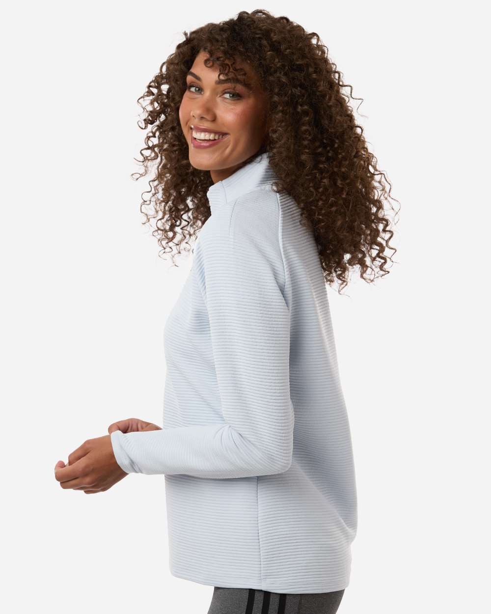Woman wearing a light gray long-sleeve shirt on a white background. Adidas Women's Spacer Quarter-Zip Pullover, Embroidered by Helmsman Stitch Co.