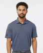 Man wearing a blue Adidas polo shirt against a white background. Adidas Men's Blended Polo, Embroidered by Helmsman Stitch Co.