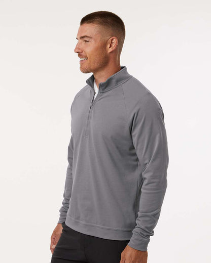 Man wearing a gray quarter-zip pullover on a white background. Adidas Men's Club Quarter-Zip Pullover, Embroidered by Helmsman Stitch Co.