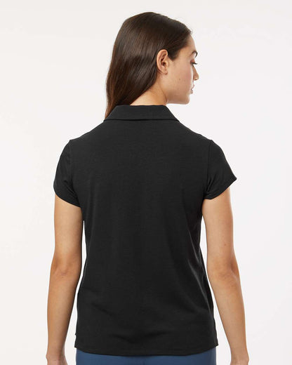 Woman wearing a black polo shirt on a white background. Adidas Women's Blended Polo, Embroidered by helmsman Stitch Co.