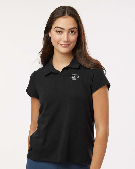 Woman wearing a black polo shirt against a white background. Adidas Women's Blended Polo, Embroidered by helmsman Stitch Co.