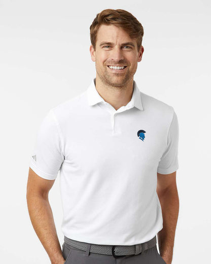 Man wearing a white polo shirt with a logo on a white background. Adidas Men's Blended Polo, Sparta Michigan Spartans logo by Helmsman Stitch Co.