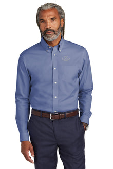 Man wearing a blue button-up shirt with a logo on a white background embroidered Brooks Brothers® Wrinkle-Free Stretch Pinpoint Shirts
