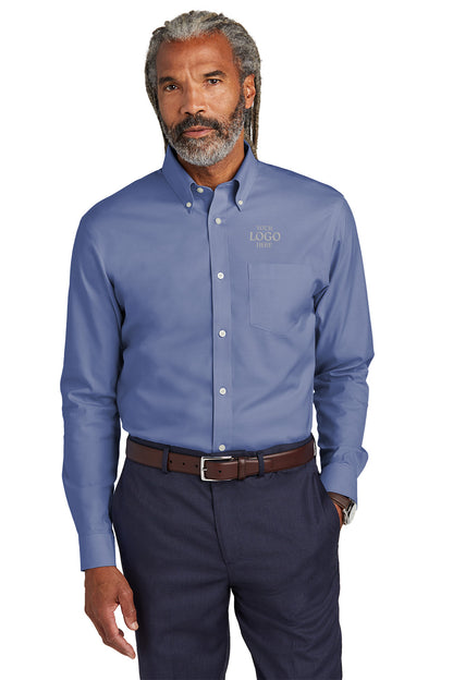 Man wearing a blue button-up shirt with a logo on a white background embroidered Brooks Brothers® Wrinkle-Free Stretch Pinpoint Shirts