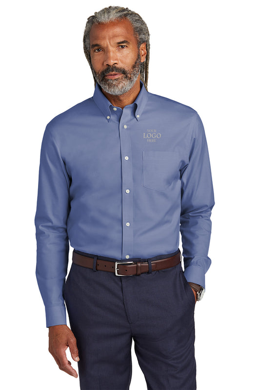 Man wearing a blue button-up shirt with a logo on a white background embroidered Brooks Brothers® Wrinkle-Free Stretch Pinpoint Shirts