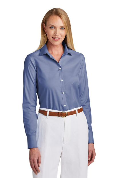 Woman wearing a blue button-up shirt and white pants on a white background embroidered Brooks Brothers® Women’s Wrinkle-Free Stretch Pinpoint Shirt