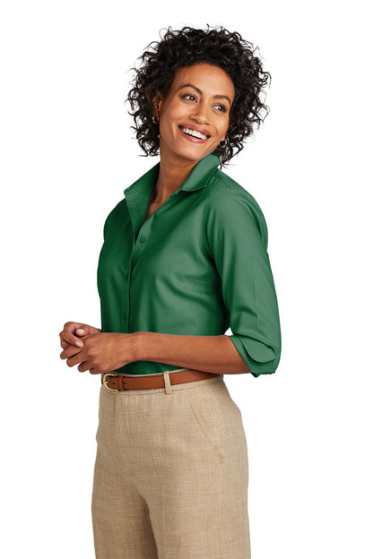 Woman wearing a green shirt and beige pants on a white background embroidered Brooks Brothers® Women’s Wrinkle-Free Stretch Nailhead Shirt