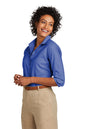 Woman wearing a blue shirt and beige pants on a white background embroidered Brooks Brothers® Women’s Wrinkle-Free Stretch Nailhead Shirt