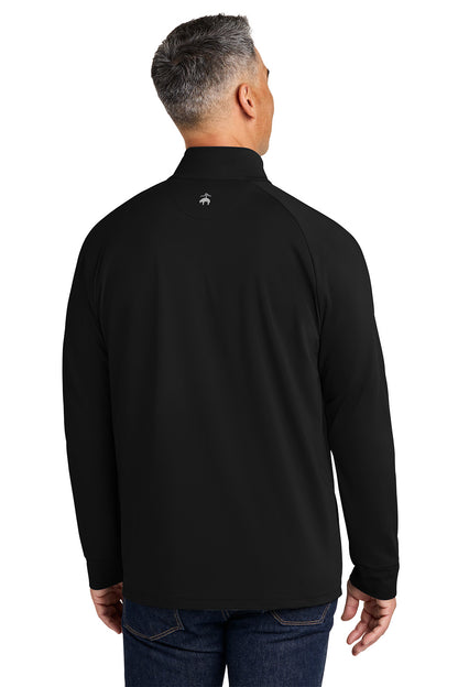 Man wearing a black long-sleeve shirt with a brand logo on the back, standing against a white background. Brooks Brothers® Luxe Performance 1/4-Zip, Embroidered