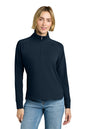Woman wearing a navy long-sleeve shirt with a quarter zip and light blue jeans on a white background, Brooks Brothers® Women's Luxe Performance 1/4-Zip, Embroidered