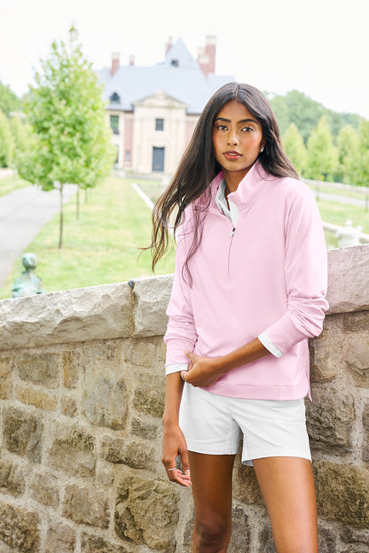Woman in a pink jacket and white shorts standing against a stone wall with a building in the background, Brooks Brothers® Women's Luxe Performance 1/4-Zip, Embroidered
