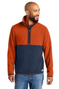 Man wearing a two-tone pullover with orange top and navy bottom on a white background Cotopaxi® Amado 1/2-Zip Fleece, Embroidered